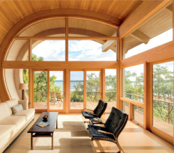 Marvin – Architects Challenge Winner – Casey Key Bay Interior Living Room featuring Ultimate Sliding French Door, Specialty Shapes, and Awning in Bare Pine.